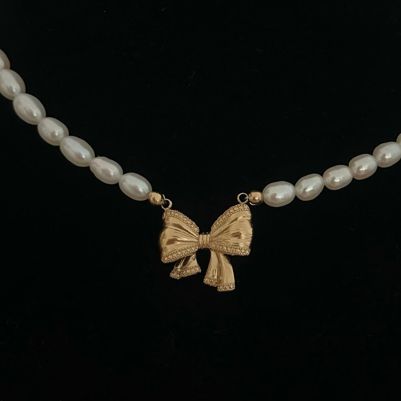 Collana perla con ciondolo Fiocco