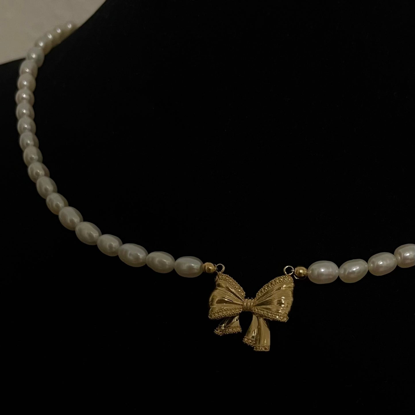 Collana perla con ciondolo Fiocco