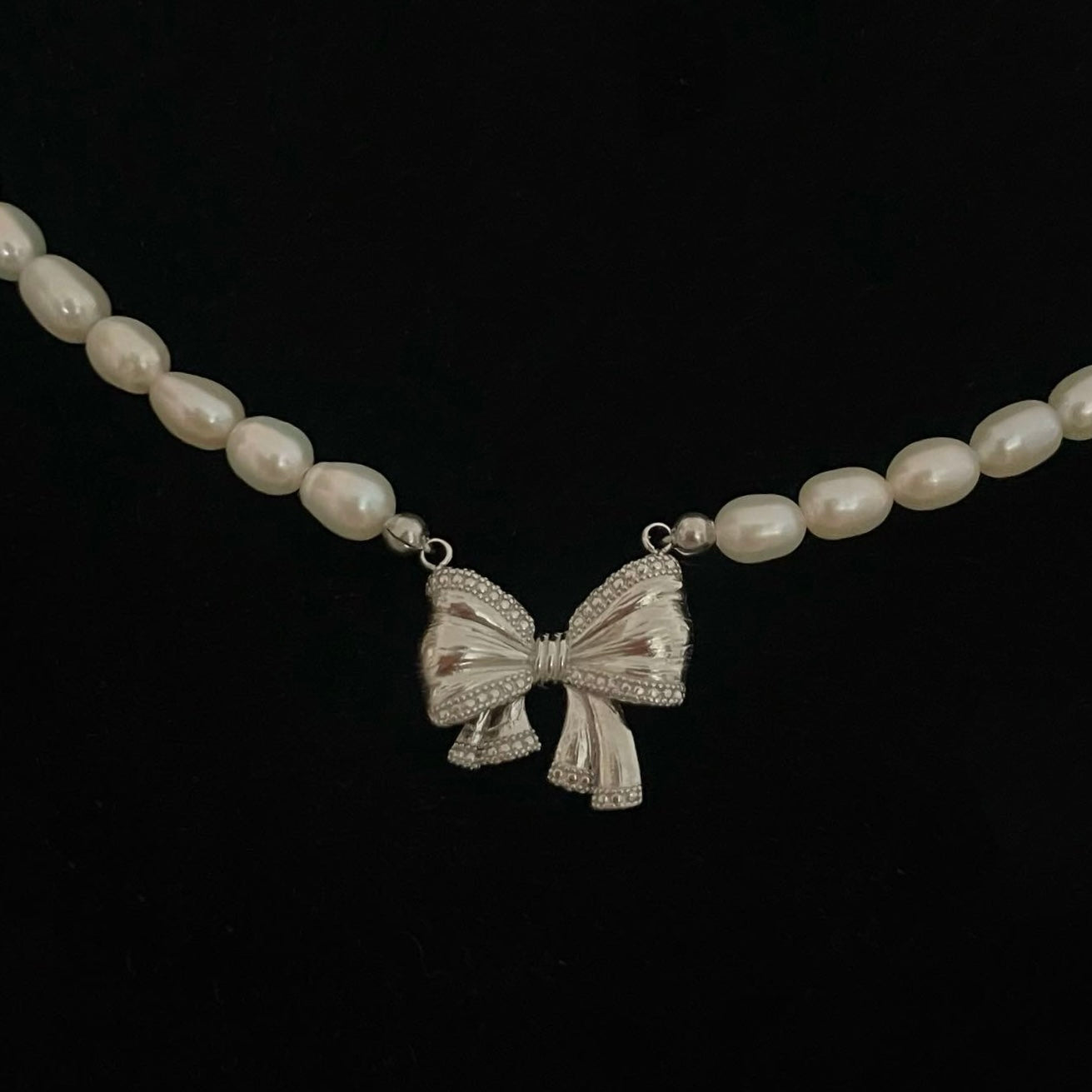 Collana perla con ciondolo Fiocco